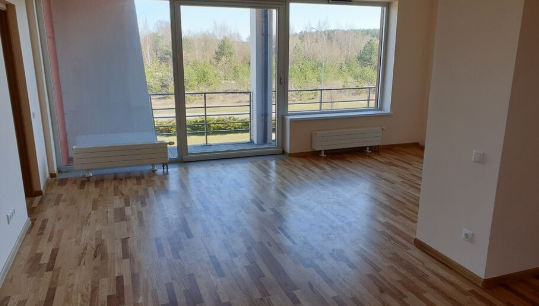 Bright room with large windows and a garden view.