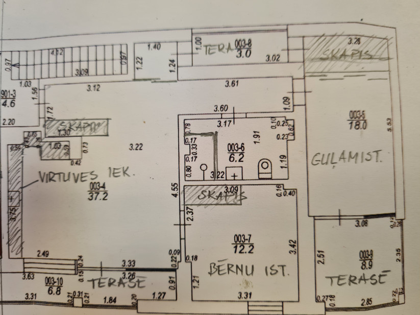 Building plan with various room layouts.