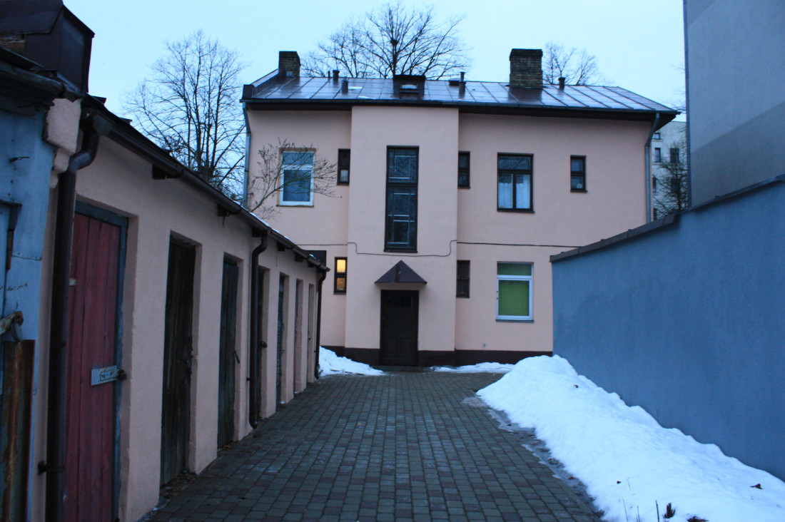Building's backside with garages.