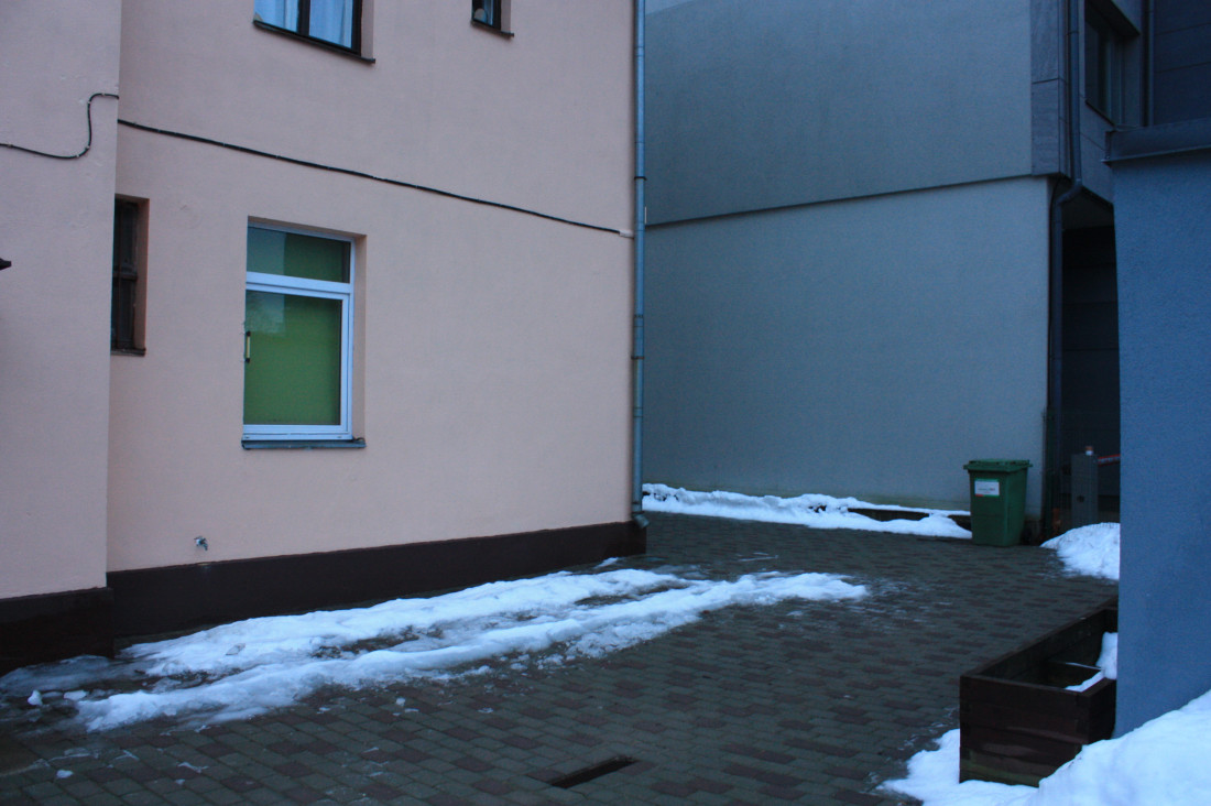House wall with snowy yard.