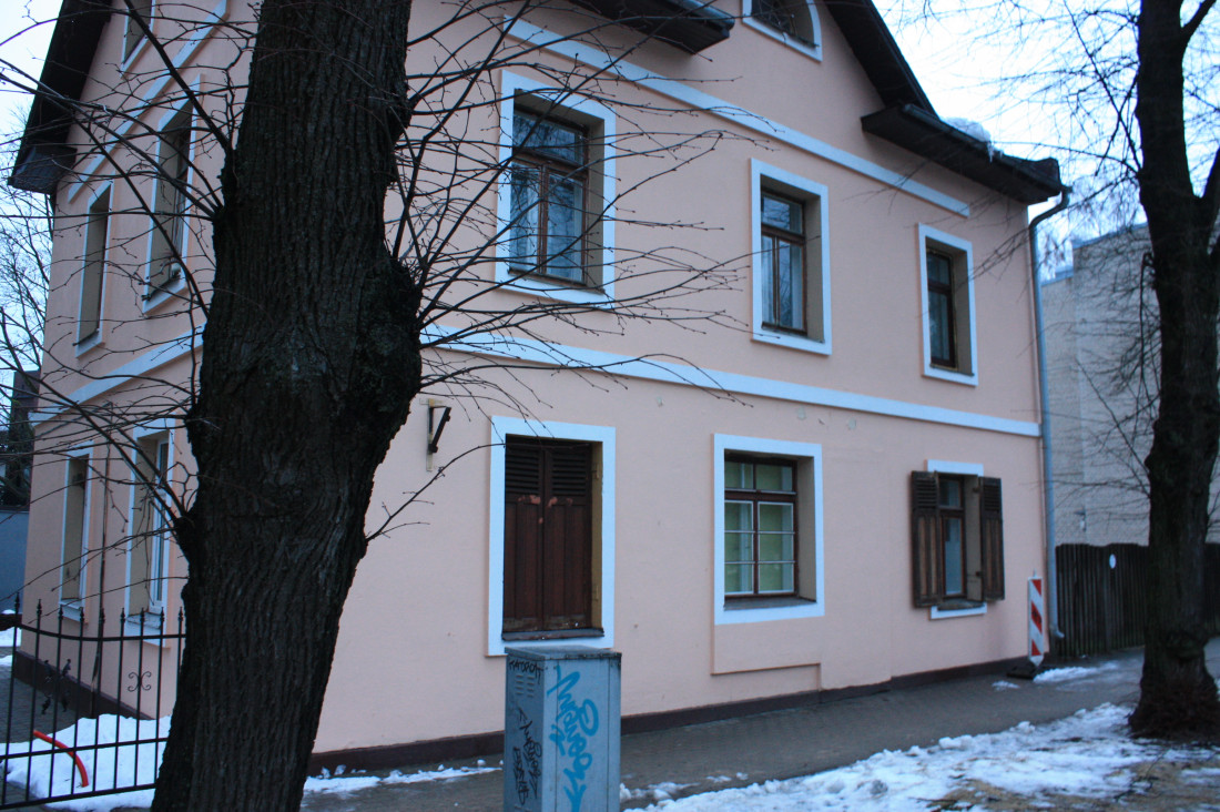  Old two-story building with windows.