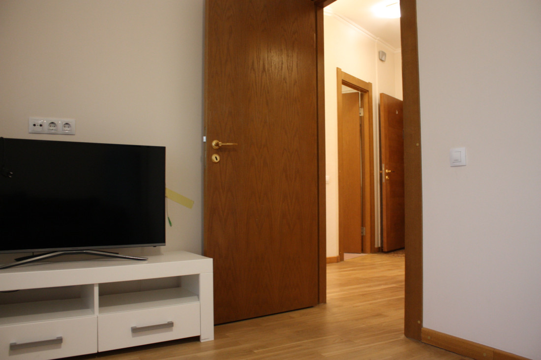 Room view with TV and door.