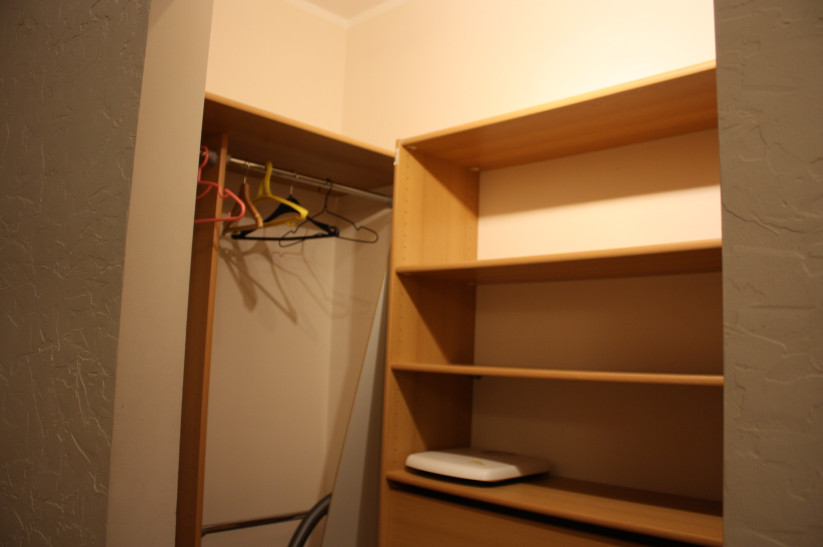Wardrobe with shelves and hangers.