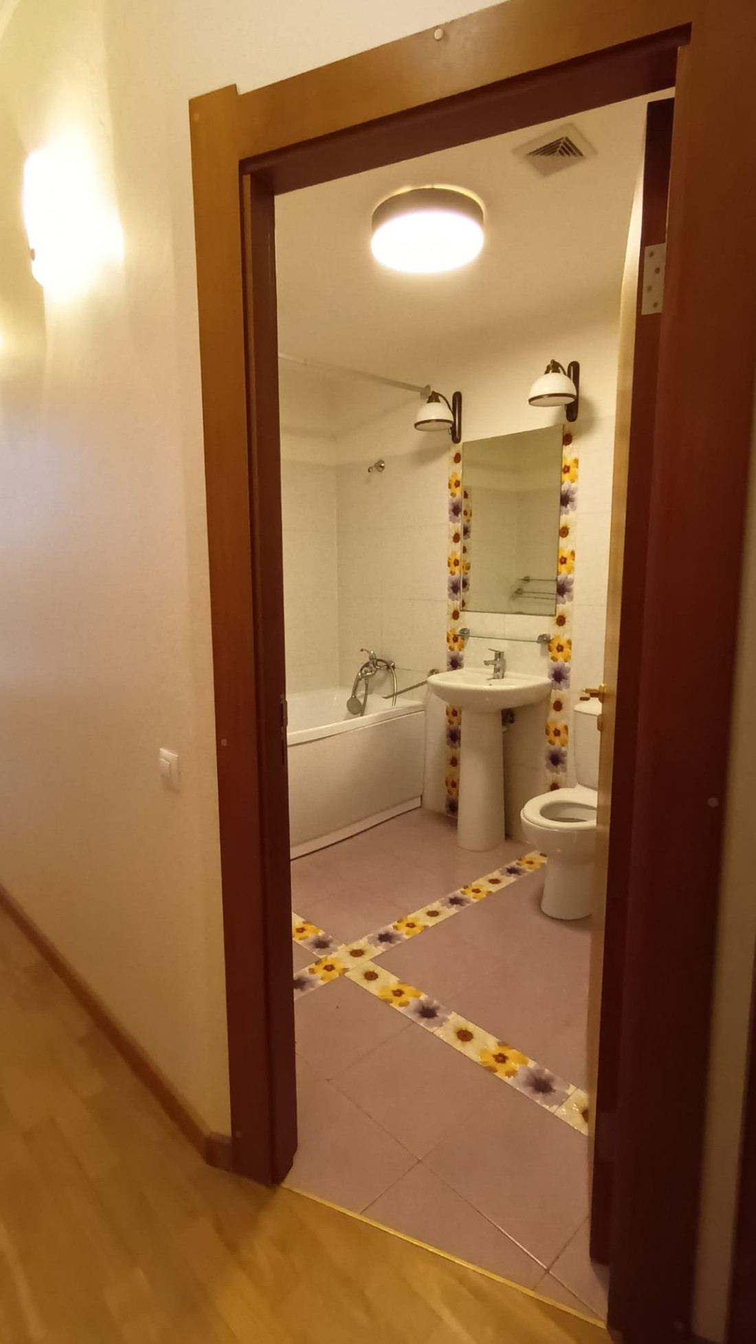 Bathroom with decorative tile accents