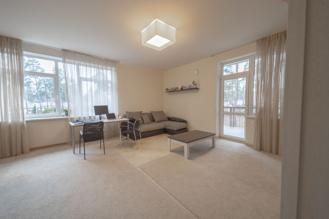 Bright bedroom with a desk by the window