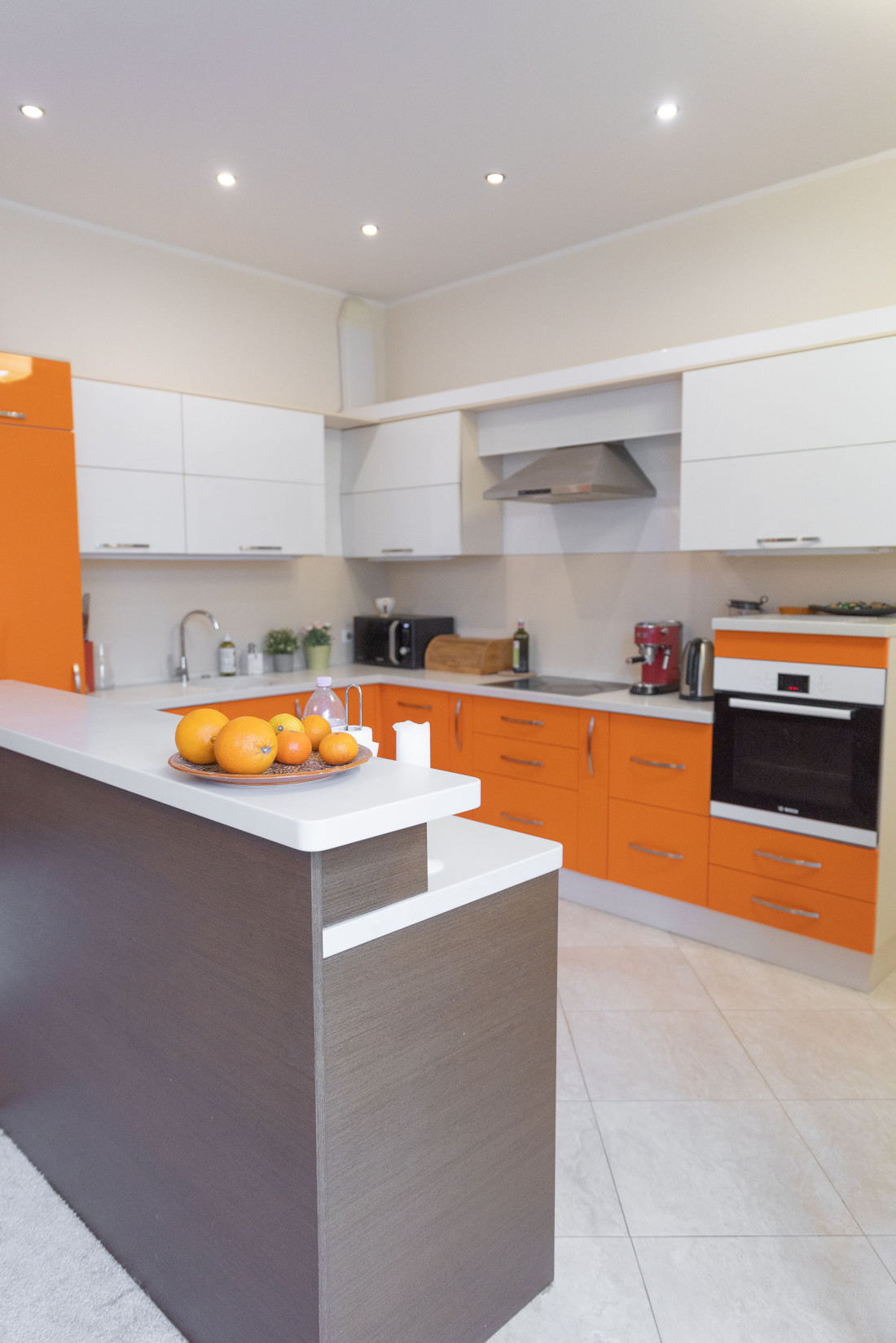 Light orange kitchen with modern built-in appliances