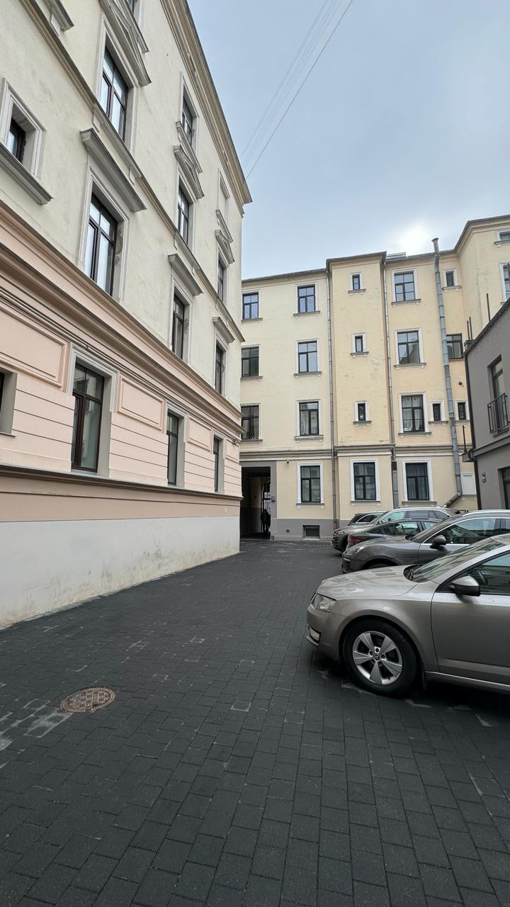 Parking area in the courtyard with buildings