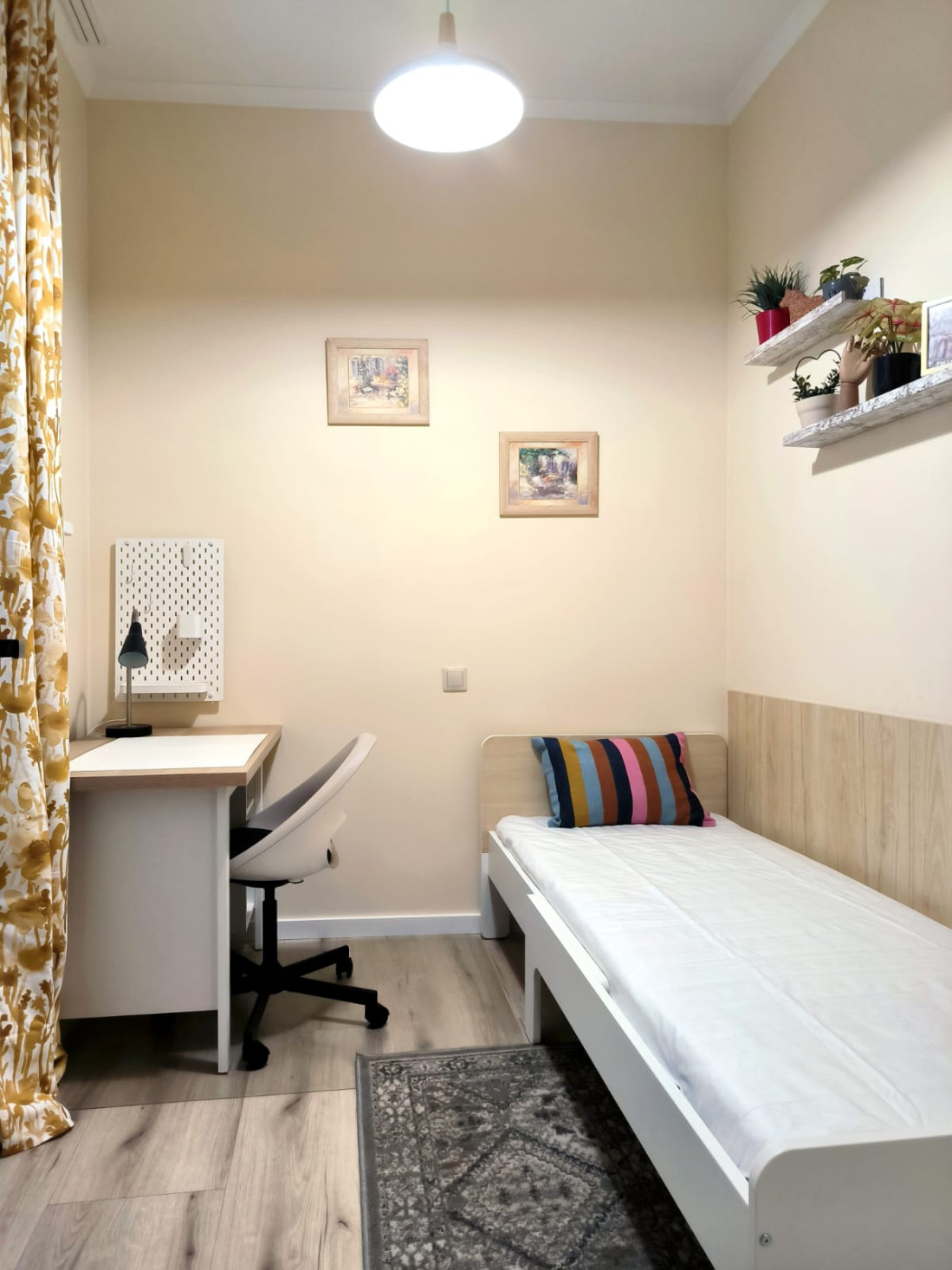 Small room with a single bed and desk.
