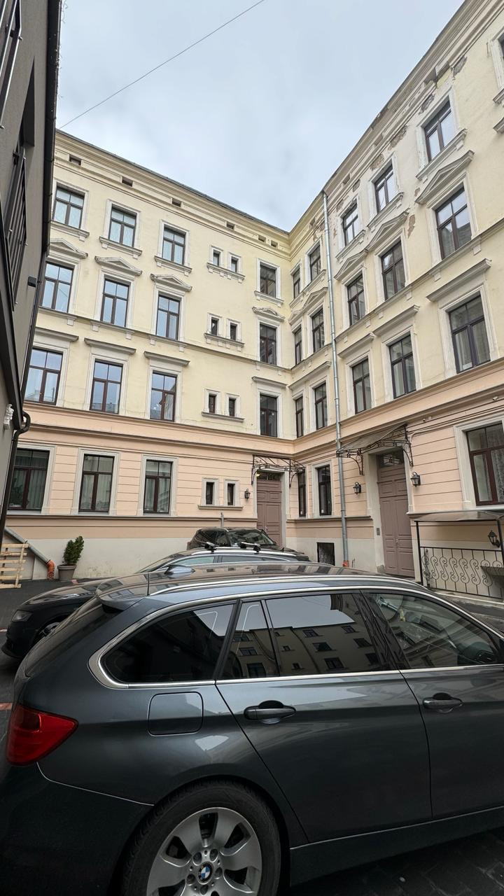 Courtyard view with cars and buildings
