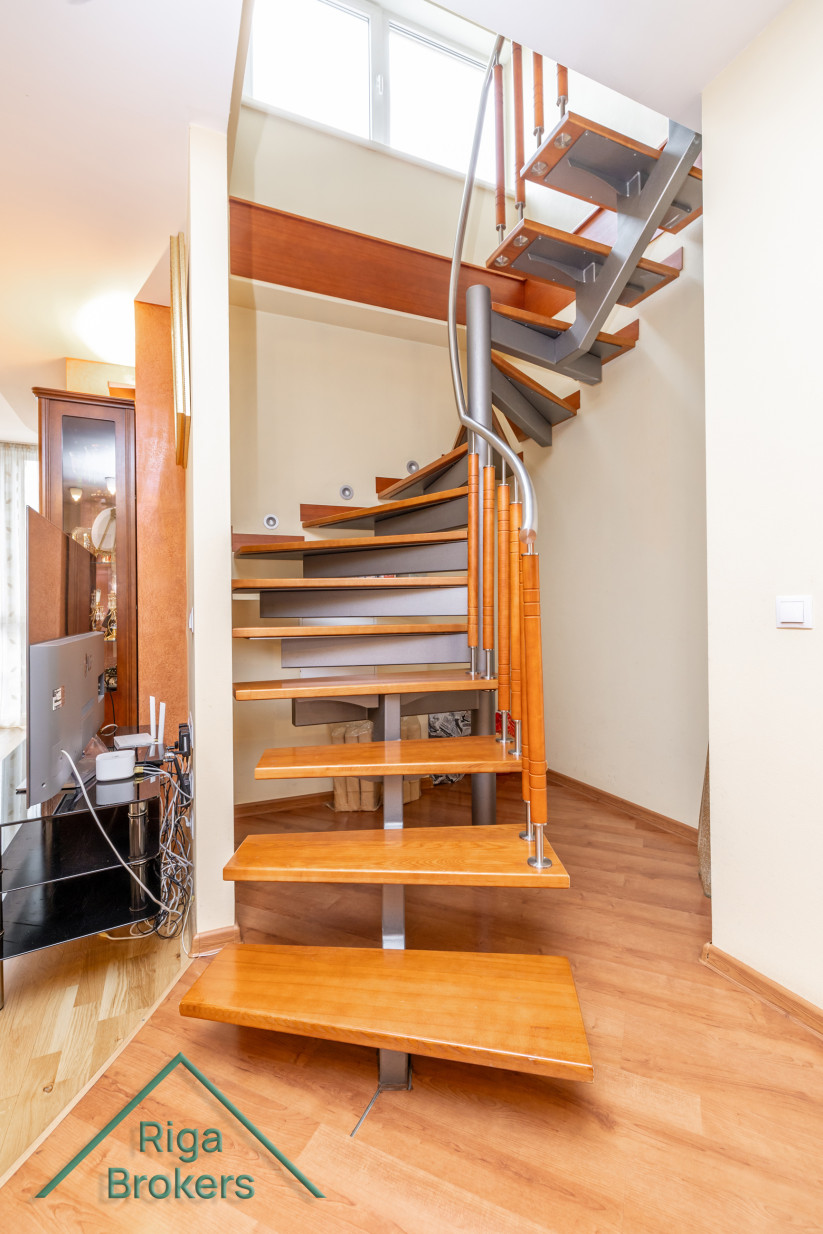 Spiral wooden staircase in modern style.