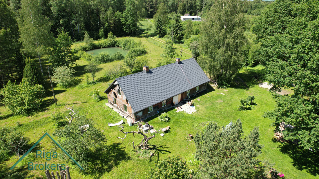 Aerial view of a countryside house with garden.