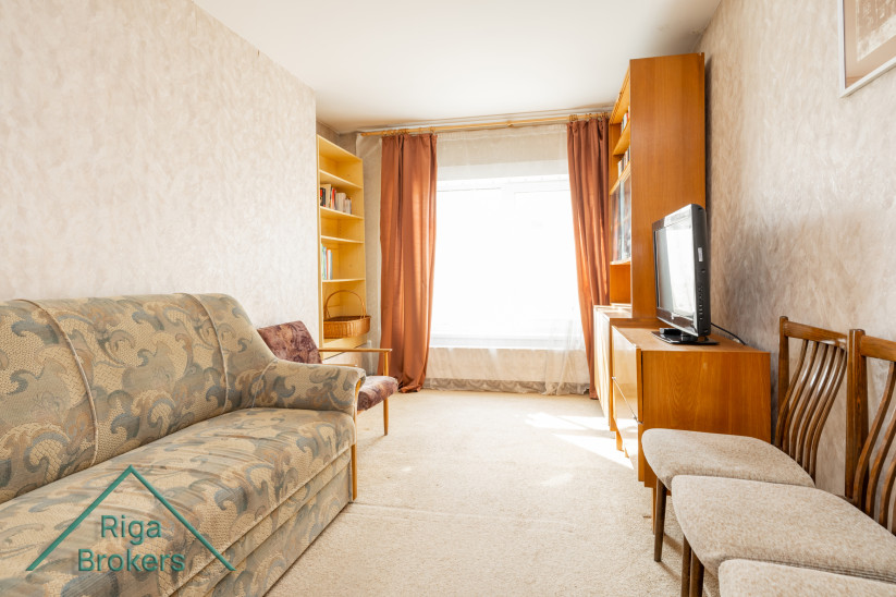 Living room with sofa and TV.