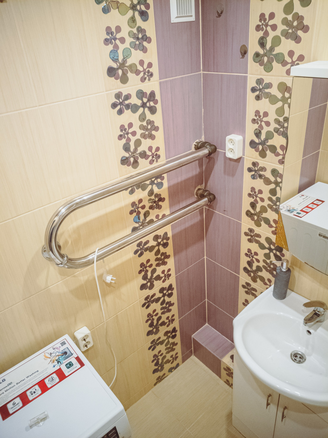 Decorative tiles on bathroom walls.