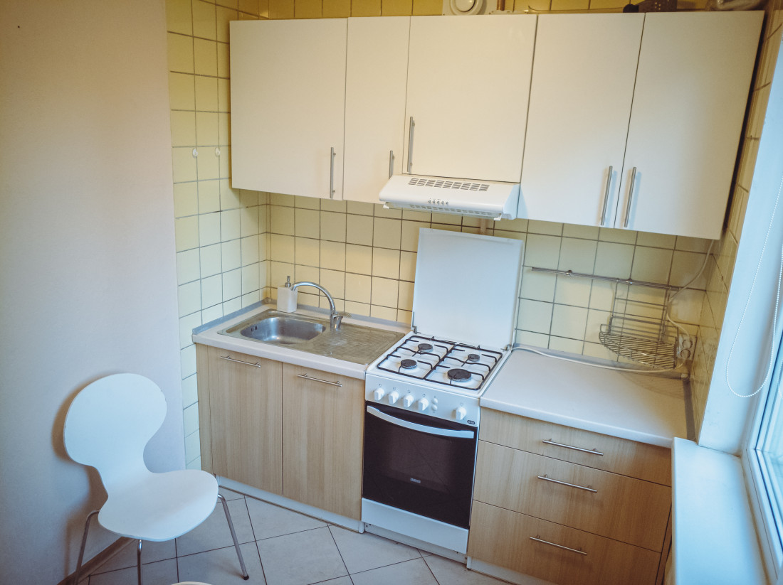  Kitchen with gas stove and cabinets.