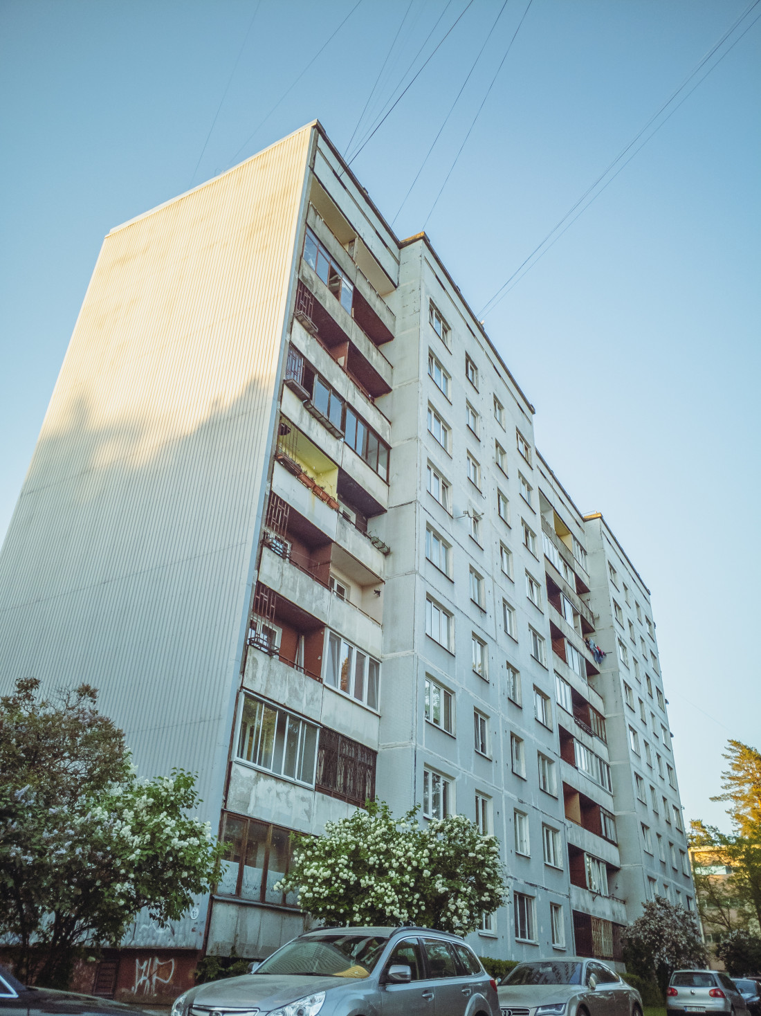 Apartment balcony with cars in the foreground