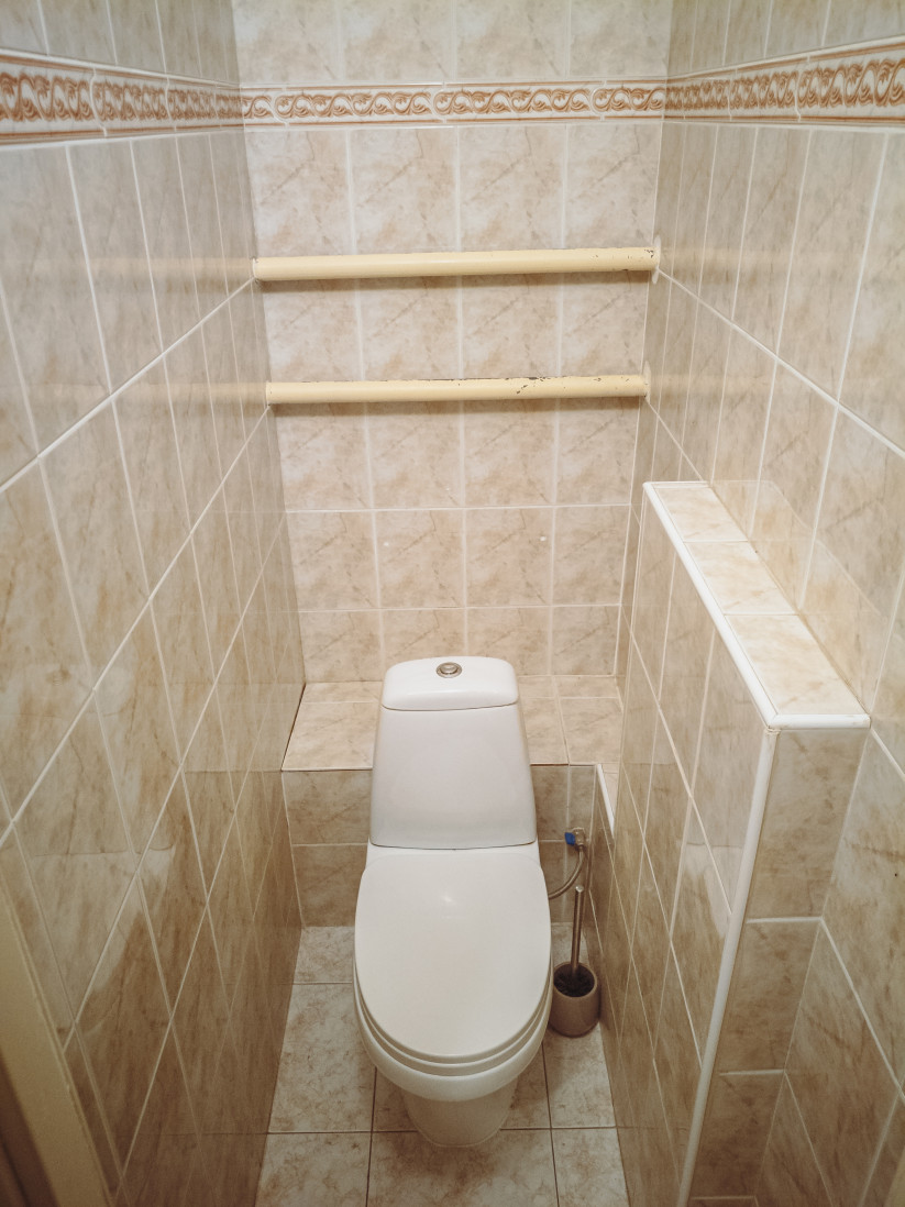 Bathroom with light tiles.
