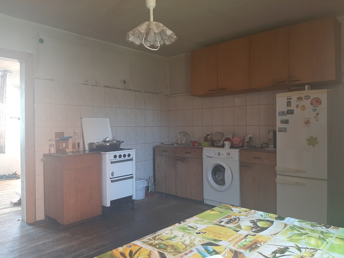  Kitchen with wooden floor and furniture.