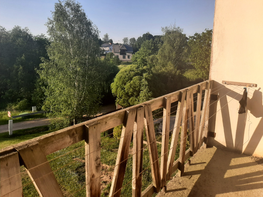  View from wooden balcony to garden.