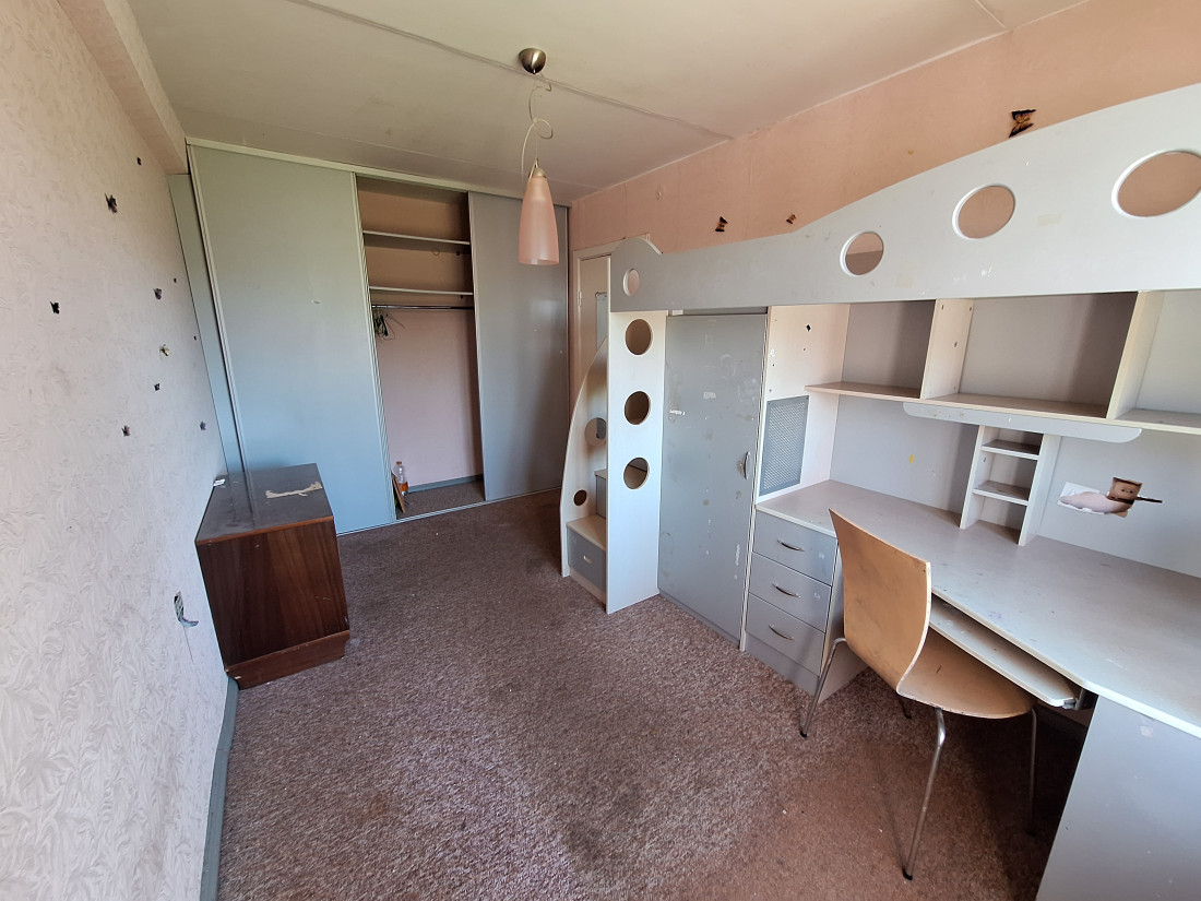 Children's room with wardrobes and shelves.