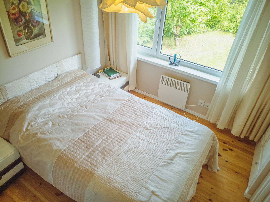 Bedroom with a large bed and window.