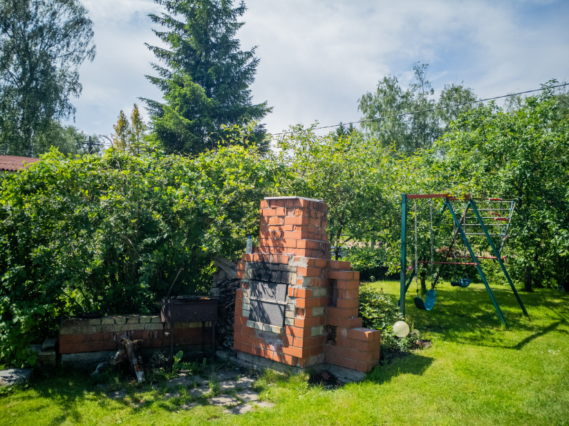  Brick grill and children's play area.