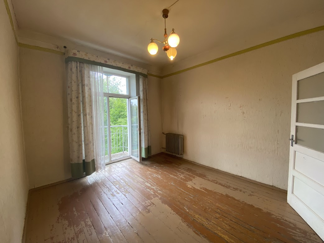 Empty room with balcony doors.