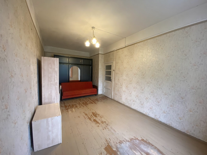 Spacious room with old furniture.