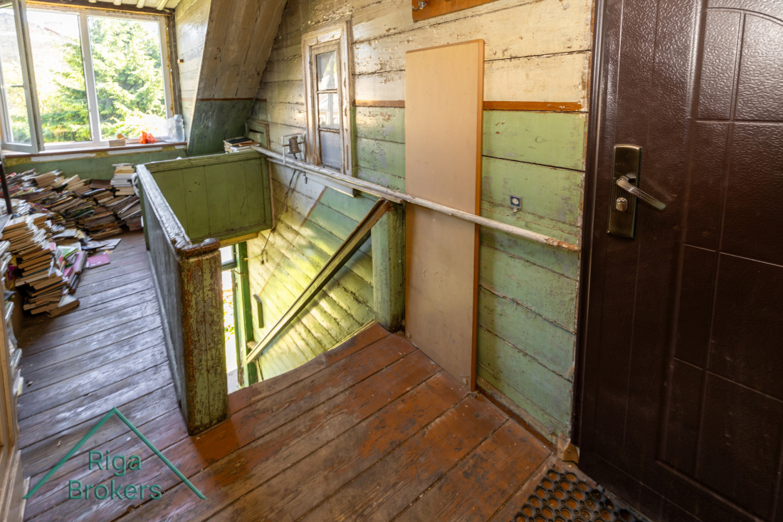 Wooden corridor with bookshelves