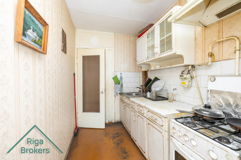 Kitchen with view to hallway and doors