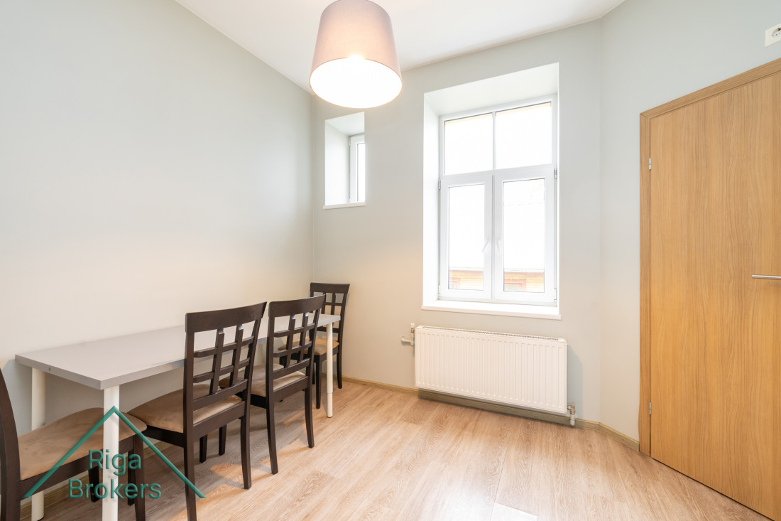 Dining room with a table and chairs.