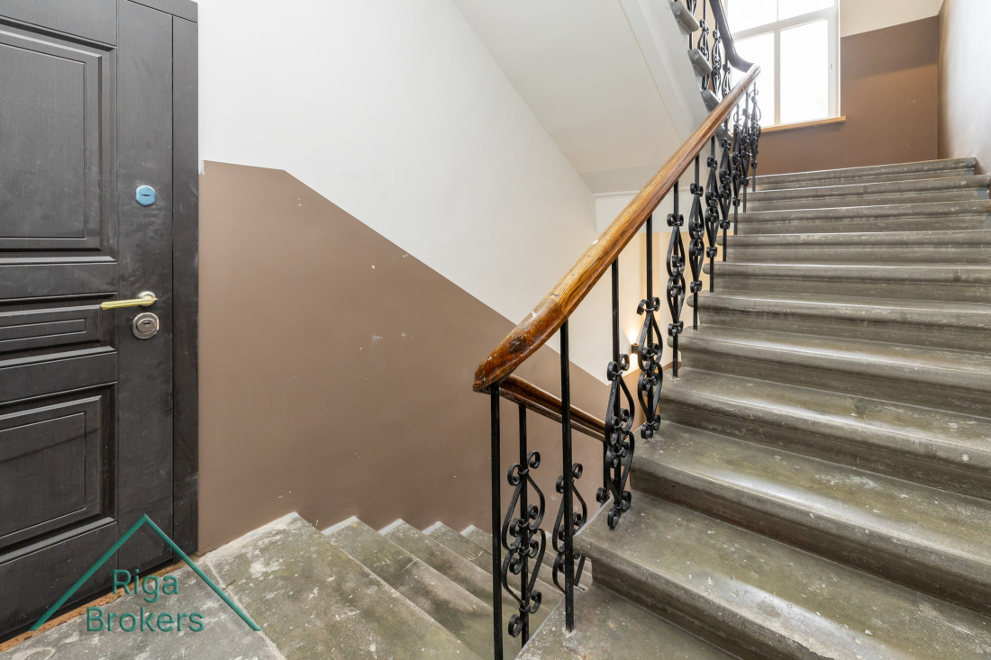 Staircase with metal railings.