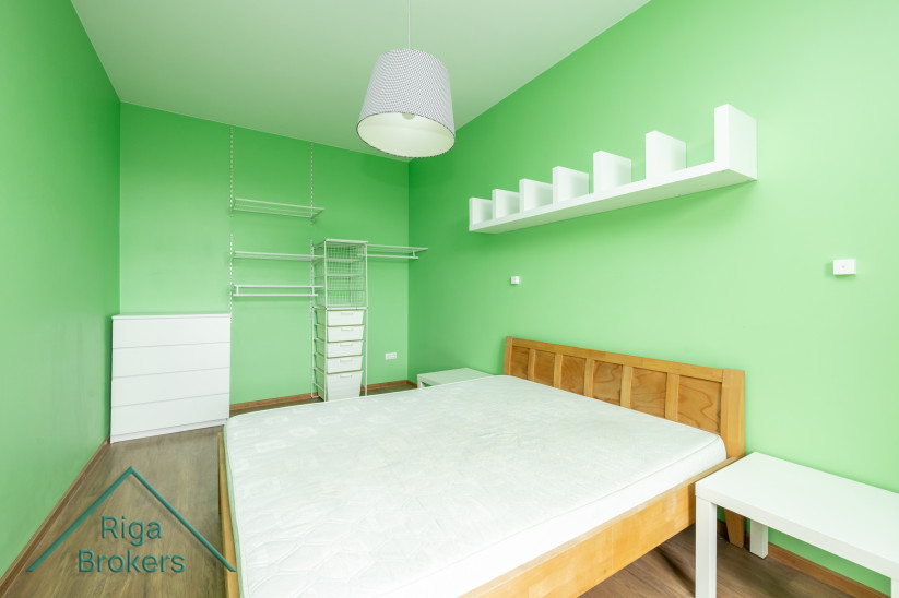 Bedroom with cabinets and shelves.