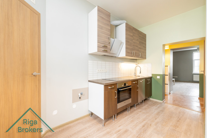 Kitchen with cabinets and appliances.