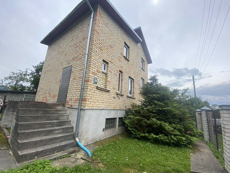 Sky above a two-story brick house