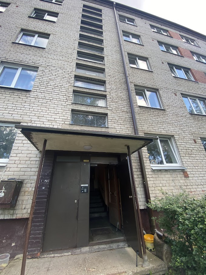Entrance of a multi-storey residential building.