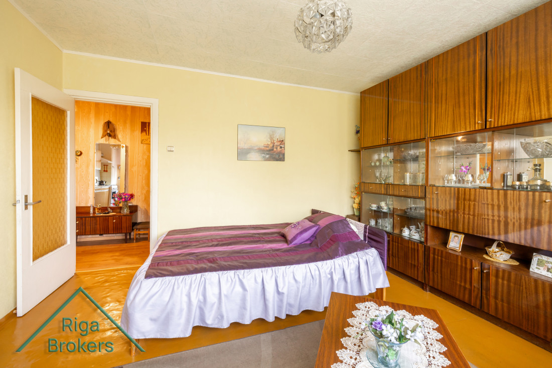 Bedroom interior with wardrobe and bed.