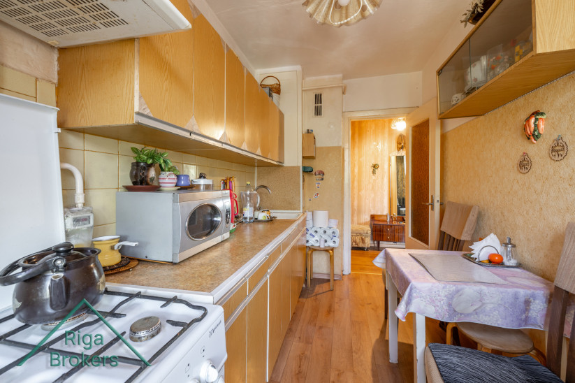 Kitchen view with dining area and exit.