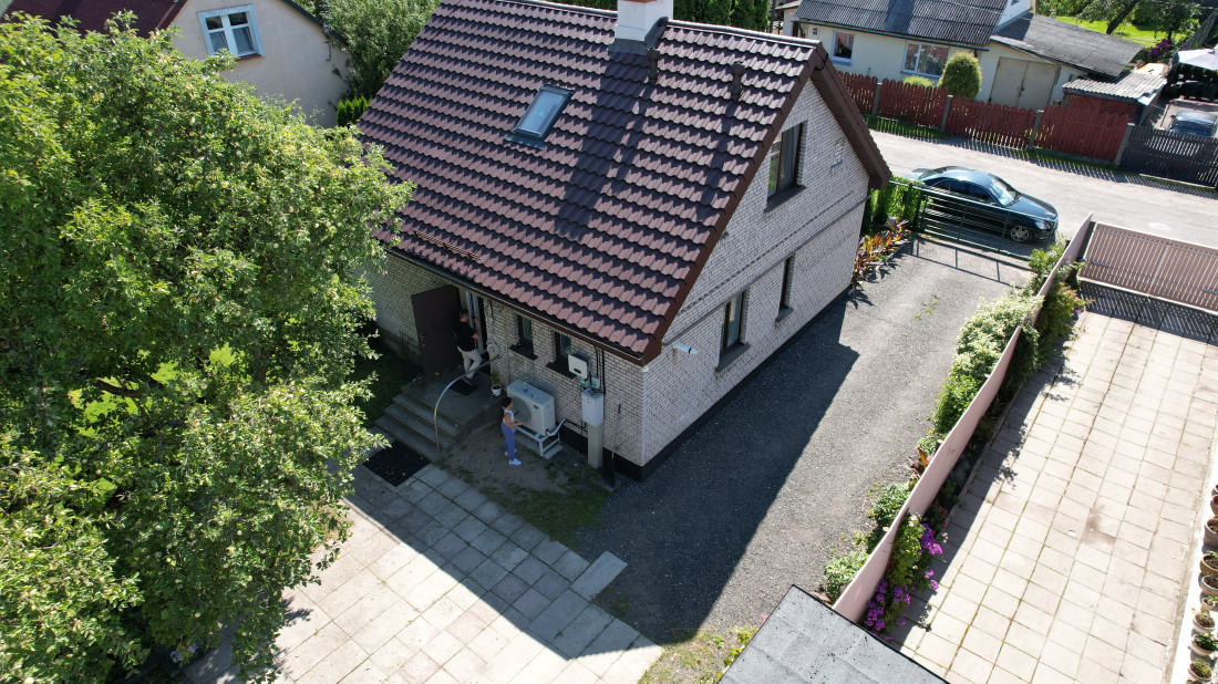Private house with yard and tree.