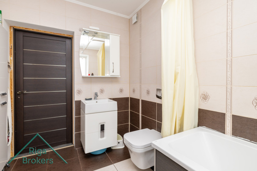 Modern bathroom with sink and mirror.