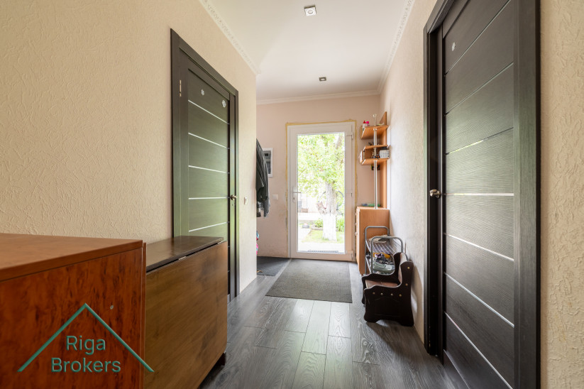  Hallway with dark doors and light wall finish.