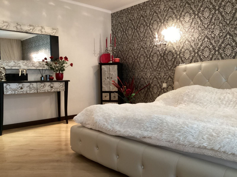 Elegant bedroom with a plush bed.