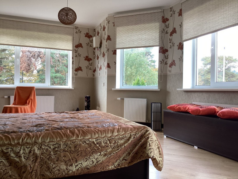 Bedroom with large windows and view.