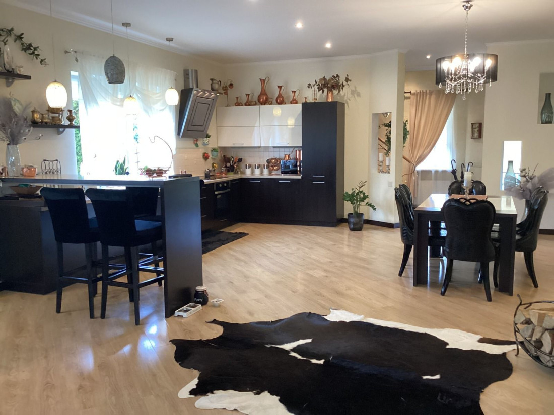 Kitchen and dining area with modern decor.