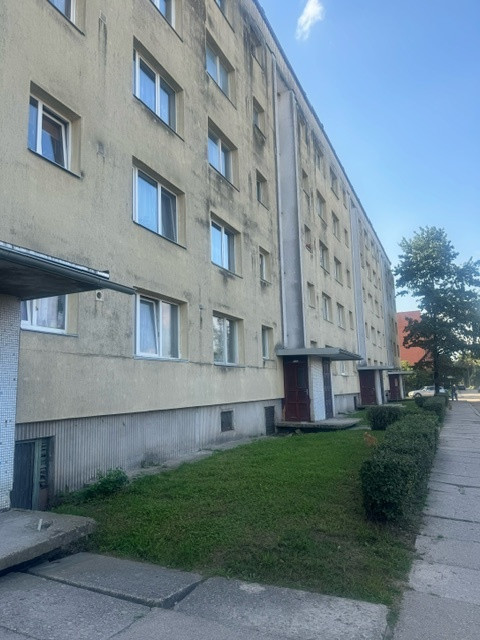 Apartment building with worn facade.