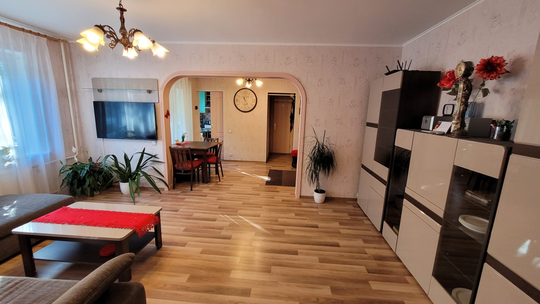 Living room with TV and dining area.