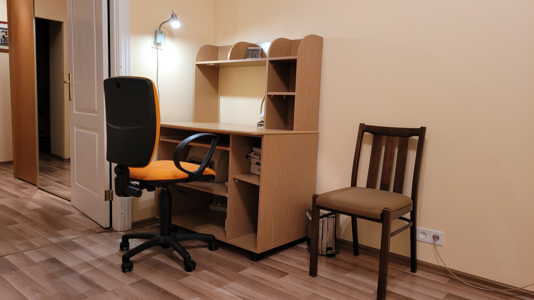 Desk corner with an office chair.