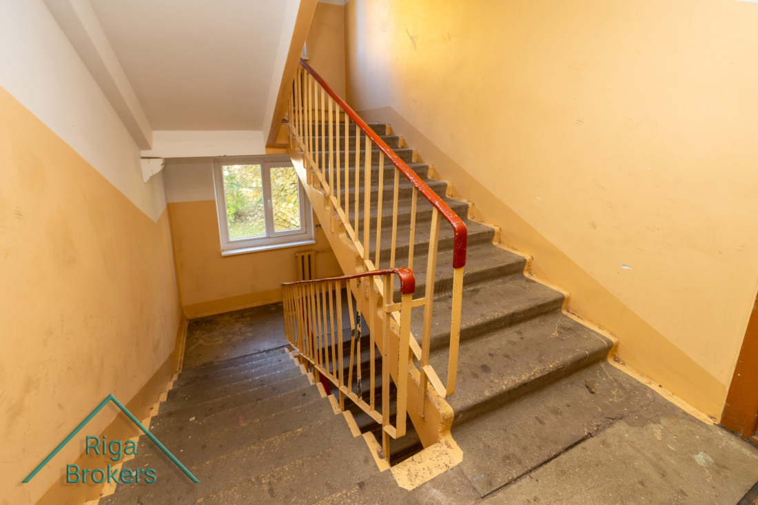  Staircase with yellow walls.