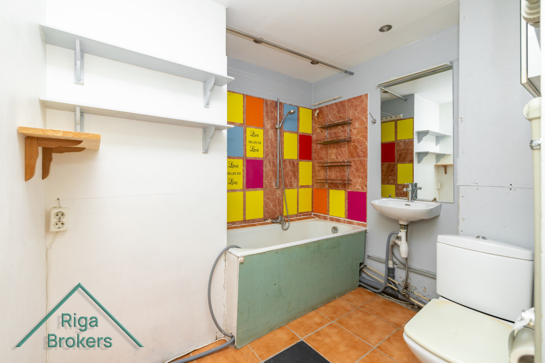 Bathroom with colorful tiles.