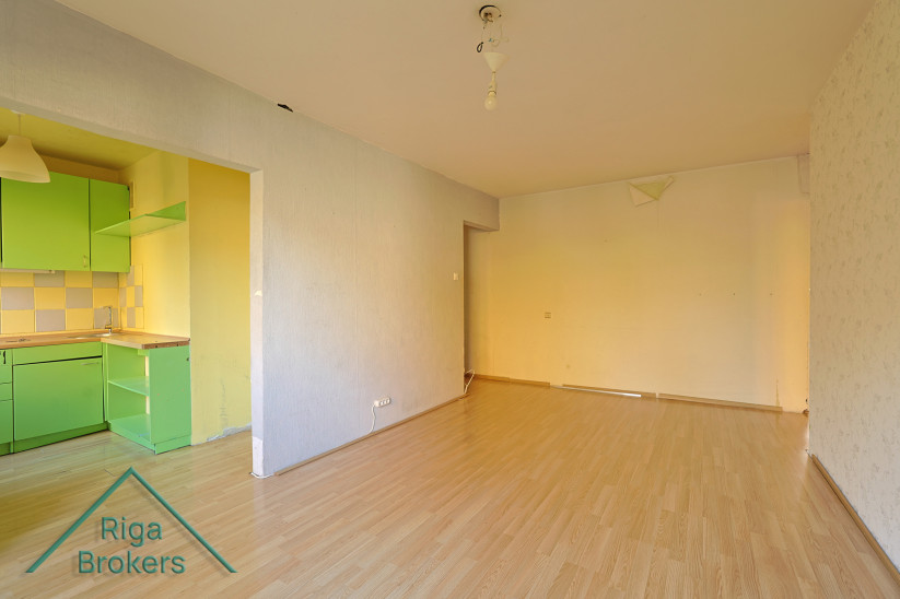 Living room with light laminate flooring.