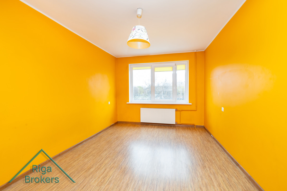 Empty room with bright orange walls.
